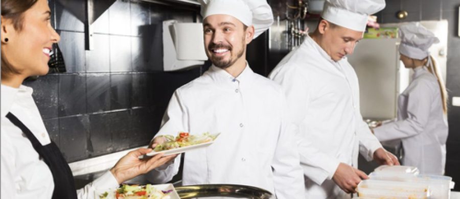 Kitchen porters working efficiently in a professional kitchen – catering job roles