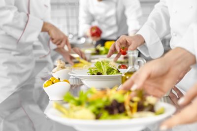 Catering staff preparing a buffet table – hospitality recruitment