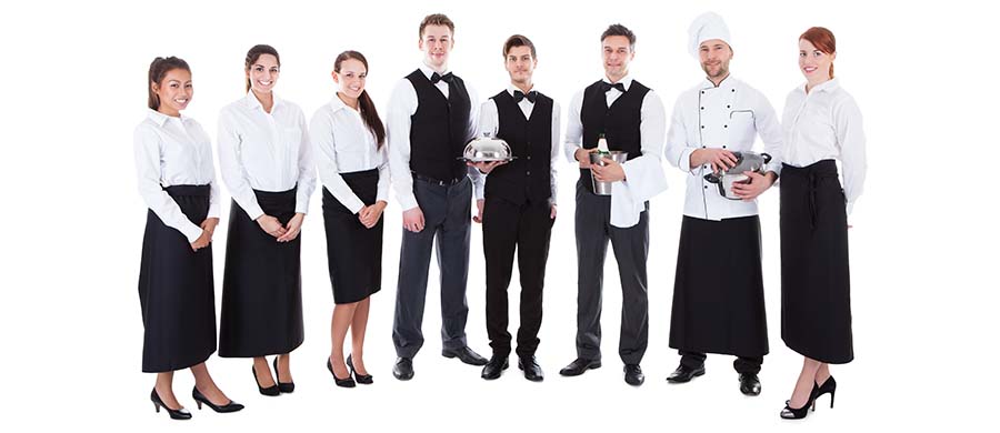 Waiters serving food at a wedding reception – catering job market