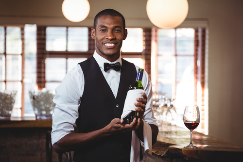 Waitstaff setting tables in a hotel restaurant – hospitality job vacancies