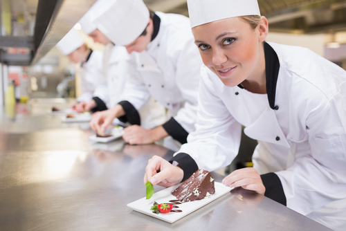Catering professionals preparing gourmet meals in a busy kitchen – catering job board