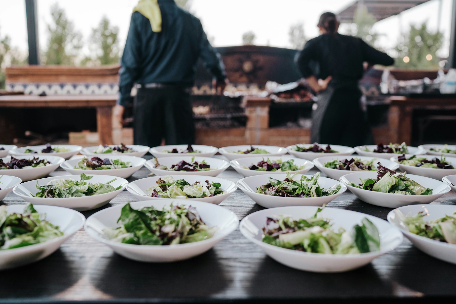 Professional kitchen staff in uniform at work – catering workforce recruitment